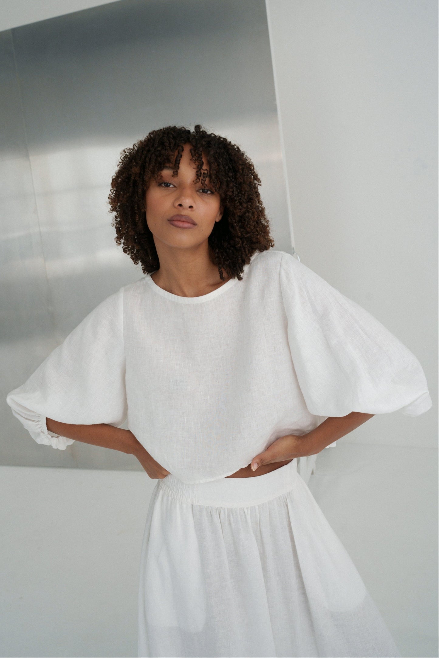 Demi Linen Top in Ivory - close-up of round neckline and puff sleeve with elasticated cuff - Lilly Pilly Collection