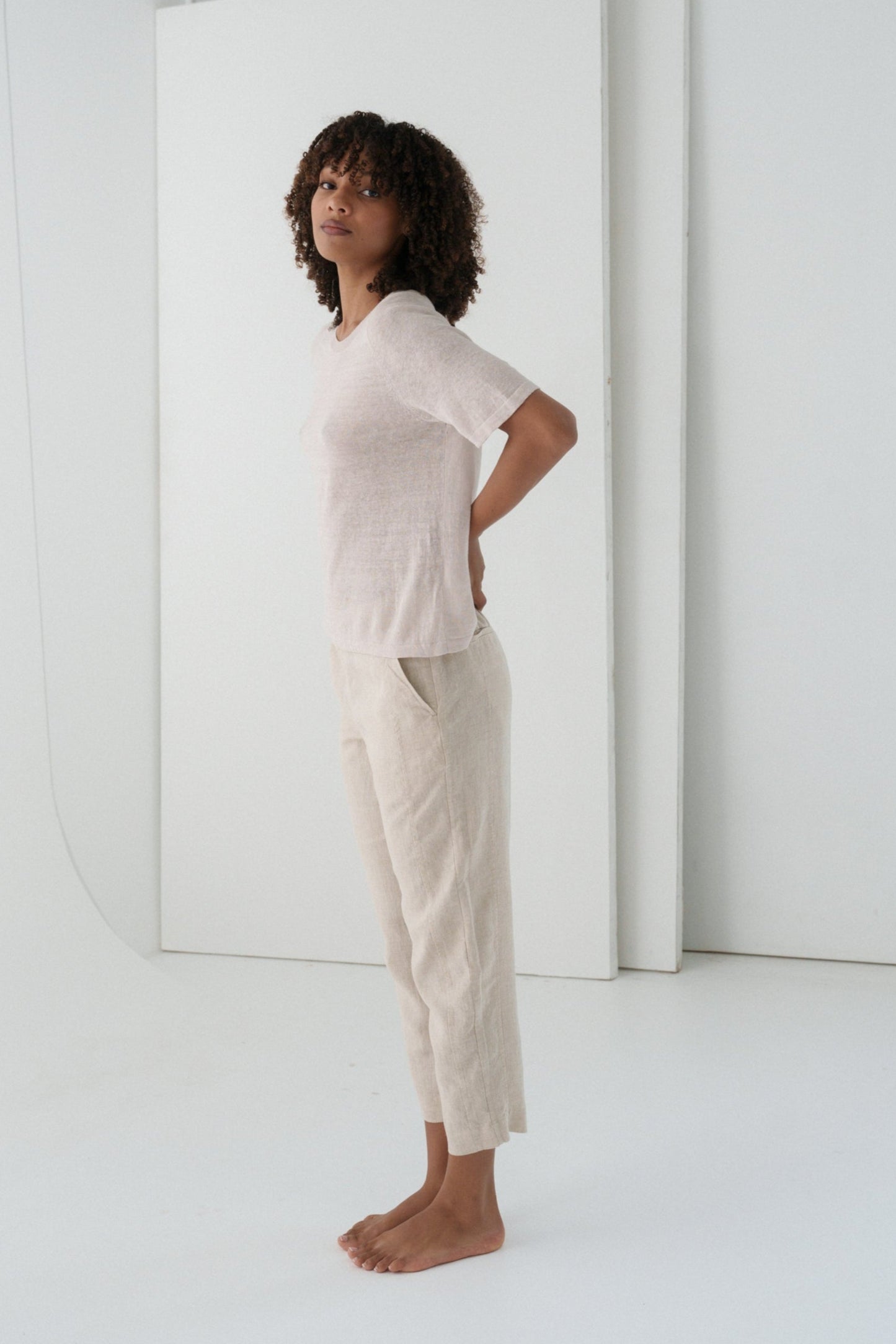 Woman wearing Grace linen knit top and Emer oatmeal linen pants