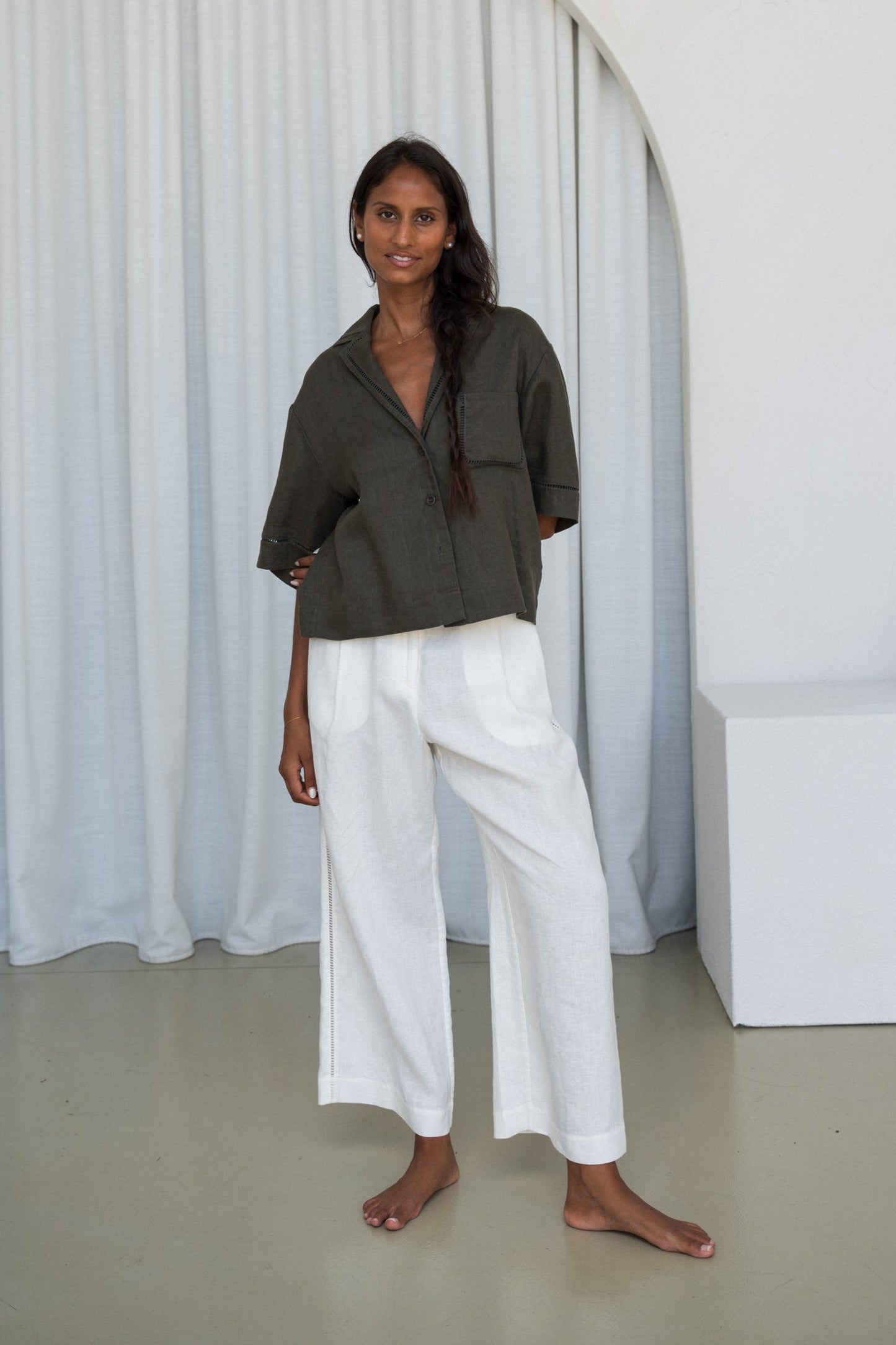 LILLY PILLY woman wearing a Pixie linen shirt in khaki with ivory Rika linen pants