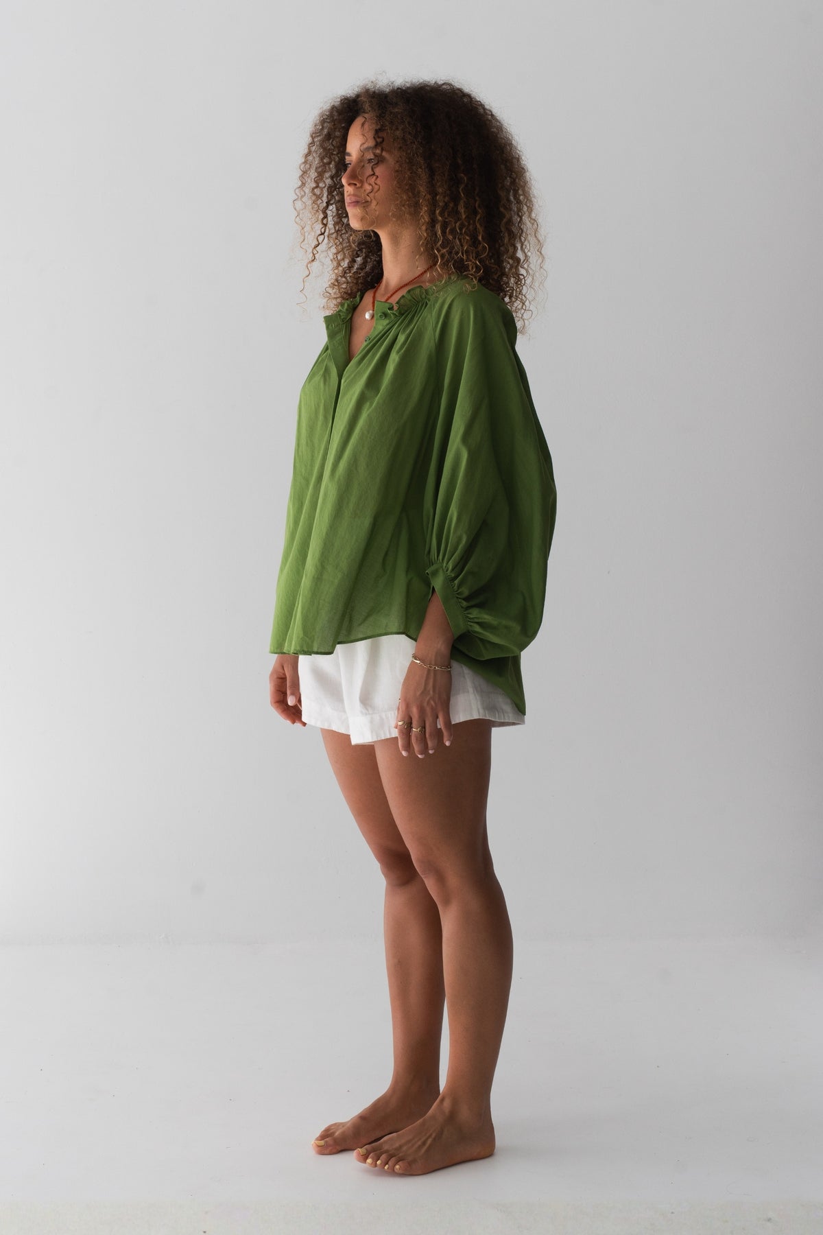 Thalia Cotton Voile Shirt in Lime Green - front view, gathered neckline and button-front, balloon sleeves, worn open as beach cover-up - Lilly Pilly Collection