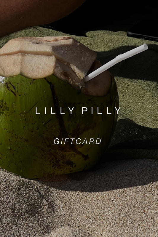 Gift card with a green coconut and leaf on a sandy background from Lilly Pilly.