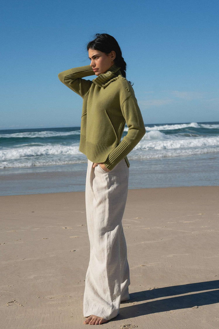 Kaida Cashmere Knit in Olive - full three quarter view of neckline details by the ocean waves - Lilly Pilly Collection