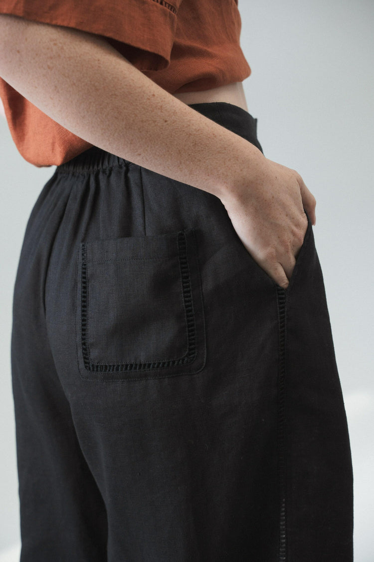 Rika Linen Pants in Black - close up side view of lace insert details - Lilly Pilly Collection