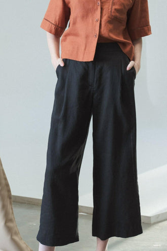 Rika Linen Pants in Black - close up front view while standing - Lilly Pilly Collection