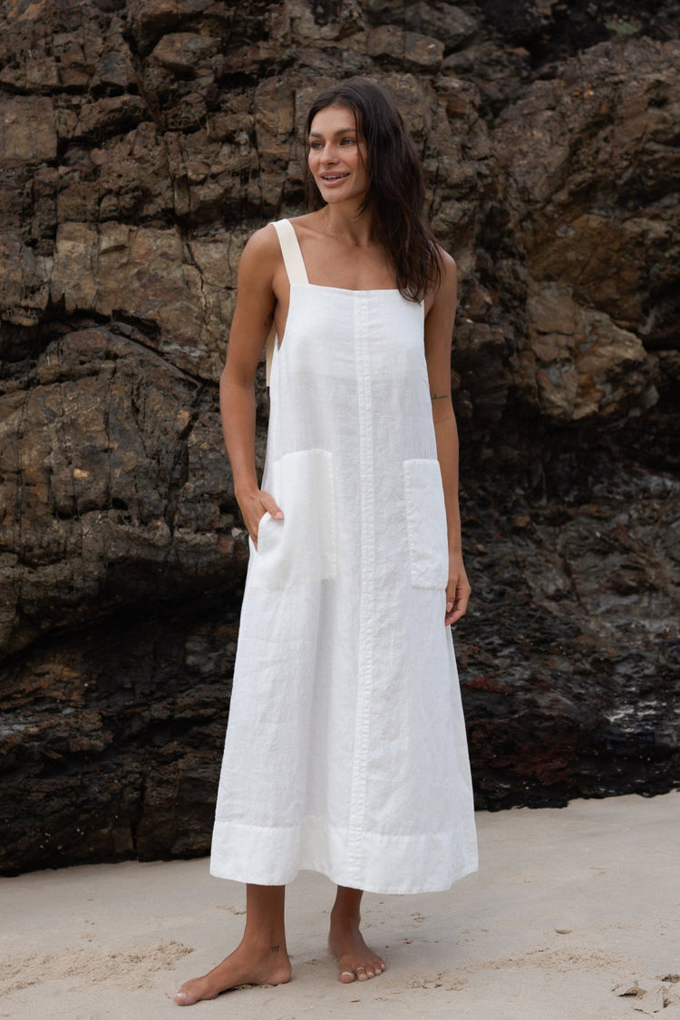 Remi Linen Dress in Ivory - full front view standing on the beach - Lilly Pilly Collection