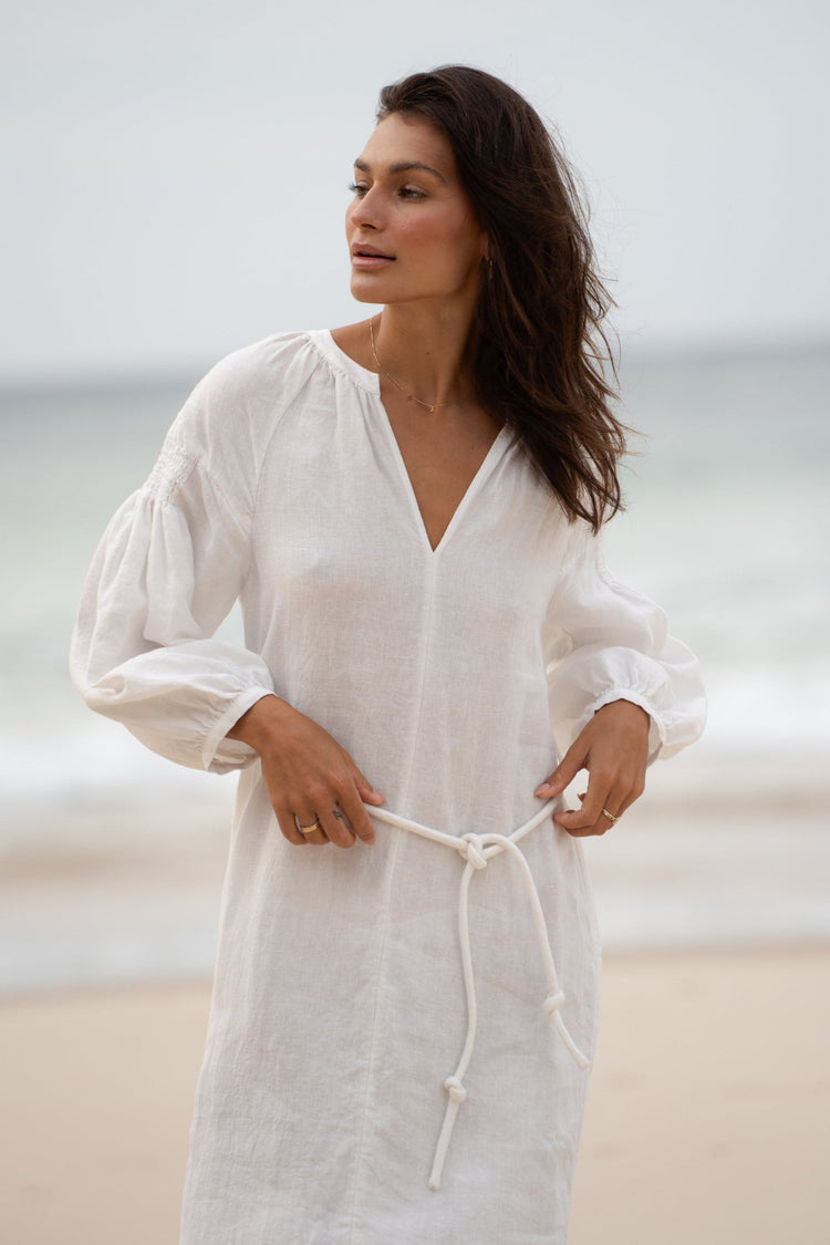Skylar Linen Dress in Ivory - front view while standing on the beach - Lilly Pilly Collection
