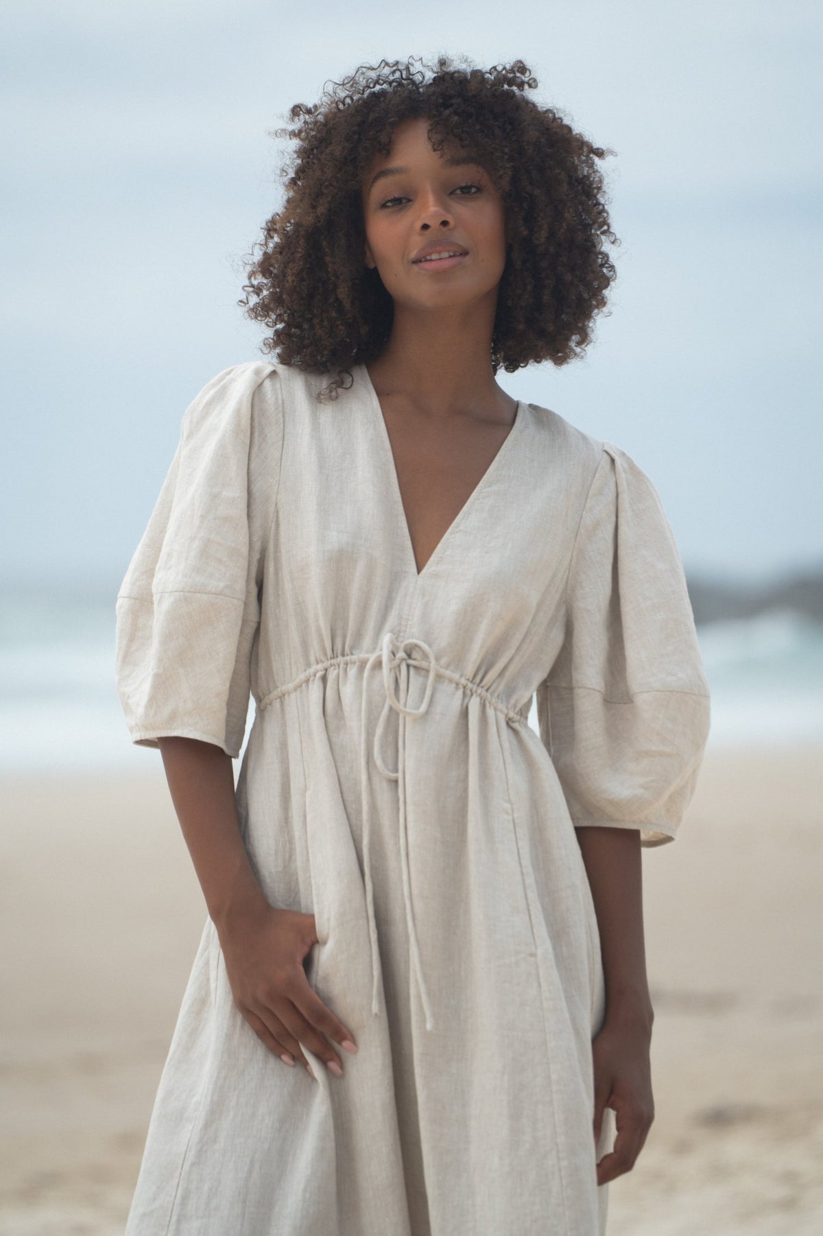 Woman wearing the Vida Linen maxi sleeve dress in Oatmeal - Lilly Pilly Collection