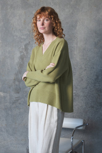 June Cashmere Knit in Olive - front view, worn with Oli Linen Pants in Ivory, studio setting - Lilly Pilly Collection