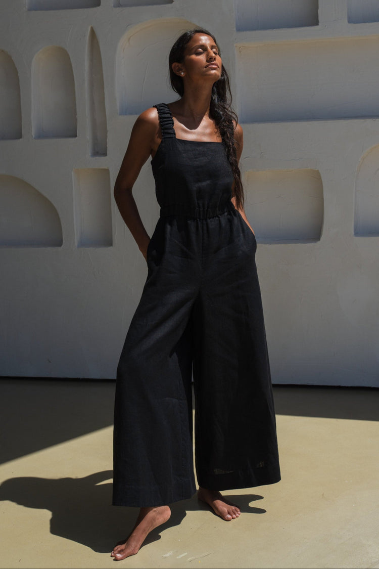 Woman wearing the Keely Linen jumpsuit in Black - Lilly Pilly Collection