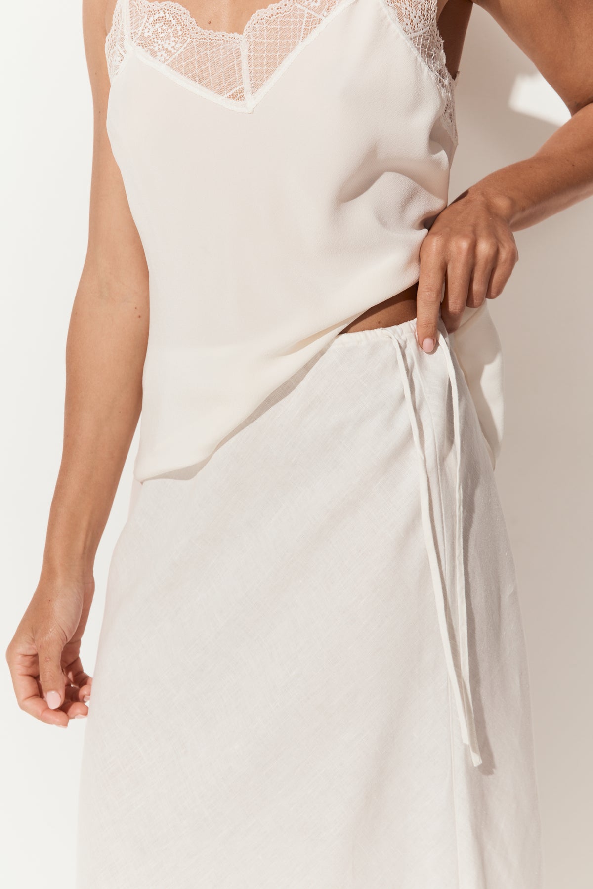 Riley Bias Linen Midi Skirt in Ivory - close up side tie detail, bias-cut midi length, with matching Frankie cami - Lilly Pilly Collection