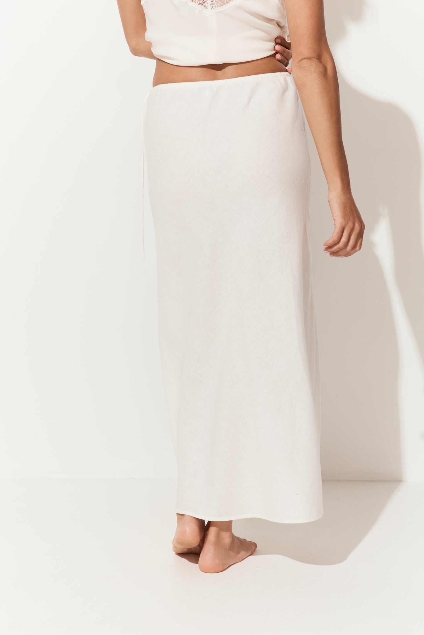 Riley Bias Linen Midi Skirt in Ivory - close up back view, bias-cut midi length - Lilly Pilly Collection