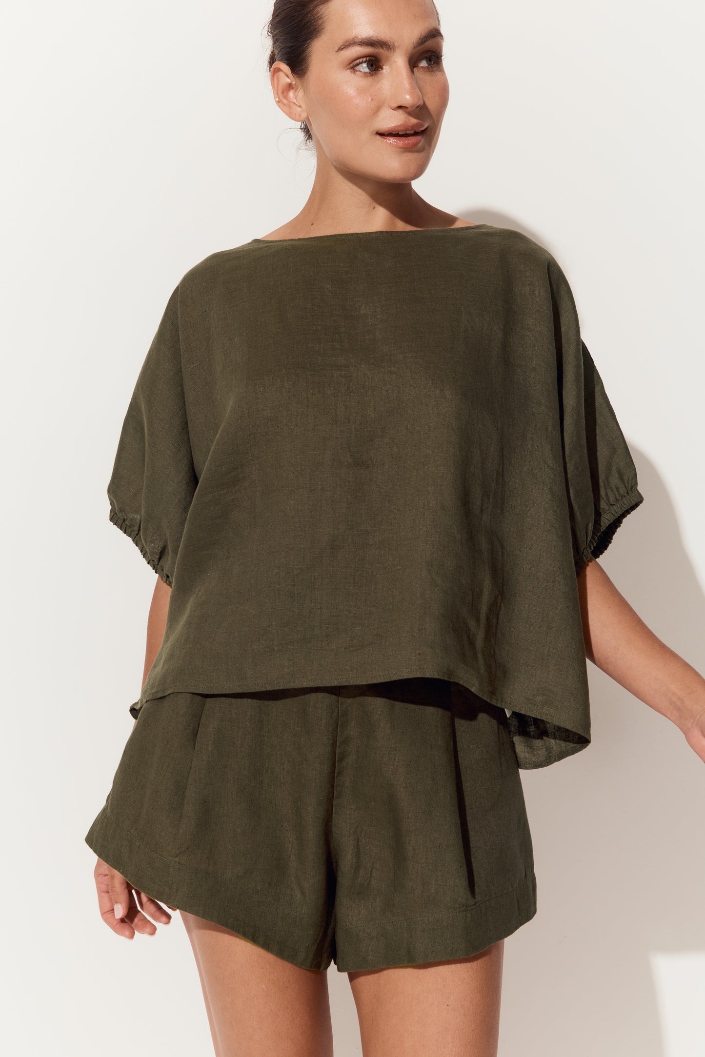 Tina Linen Top in Khaki - close up view, round neckline and batwing sleeves with elasticated cuffs - Lilly Pilly Collection