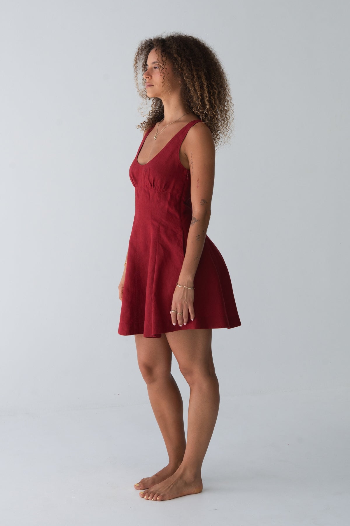 Adele Linen Short Dress in Cherry Red - side profile, pleated short dress silhouette - Lilly Pilly Collection