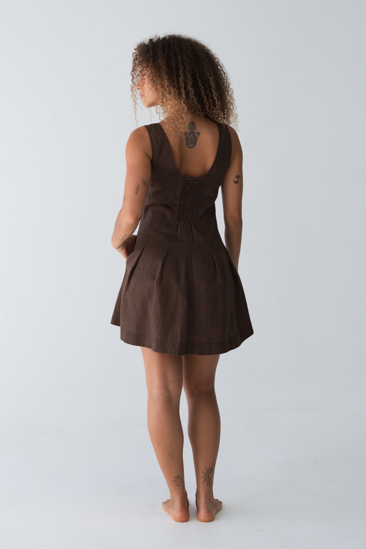 Adele Linen Short Dress in Chocolate - back view, Round with smocked detail and pleated dress - Lilly Pilly Collection
