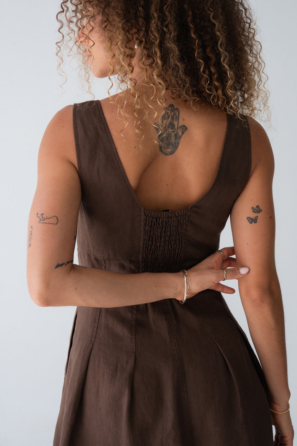 Adele Linen Short Dress in Chocolate - back view, V-back with smocked detail and pleated skirt - Lilly Pilly Collection