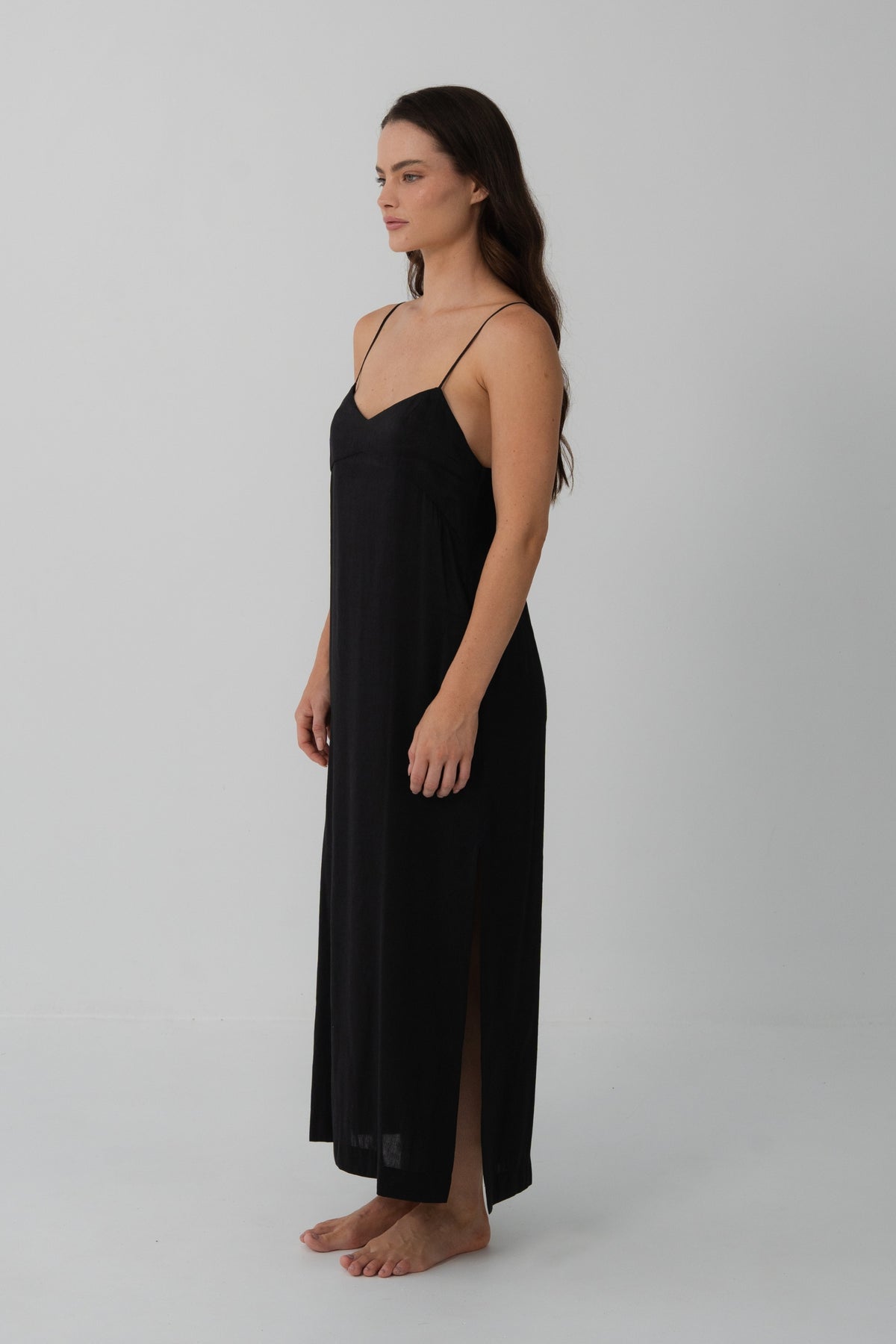 Ally Linen Silk Midi Slip Dress in Black - three-quarter view, V-neckline and fluid midi length - Lilly Pilly Collection
