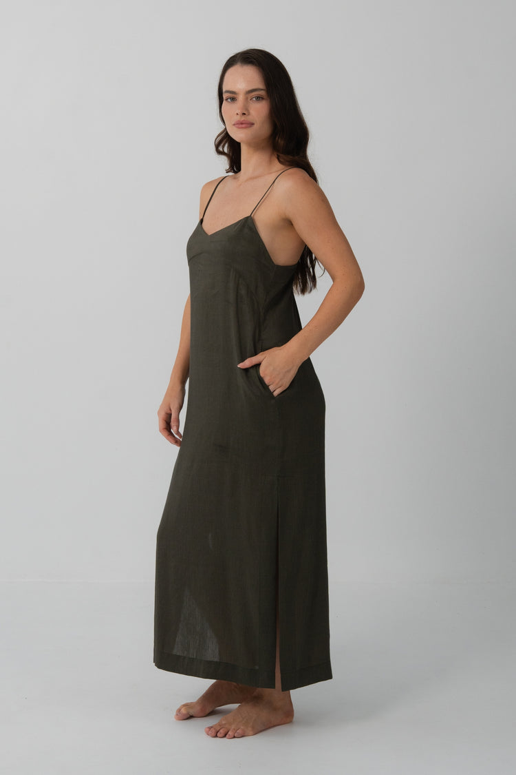 Ally Linen Silk Midi Slip Dress in Khaki - three-quarter view, hand in pocket, V-neckline and side split - Lilly Pilly Collection