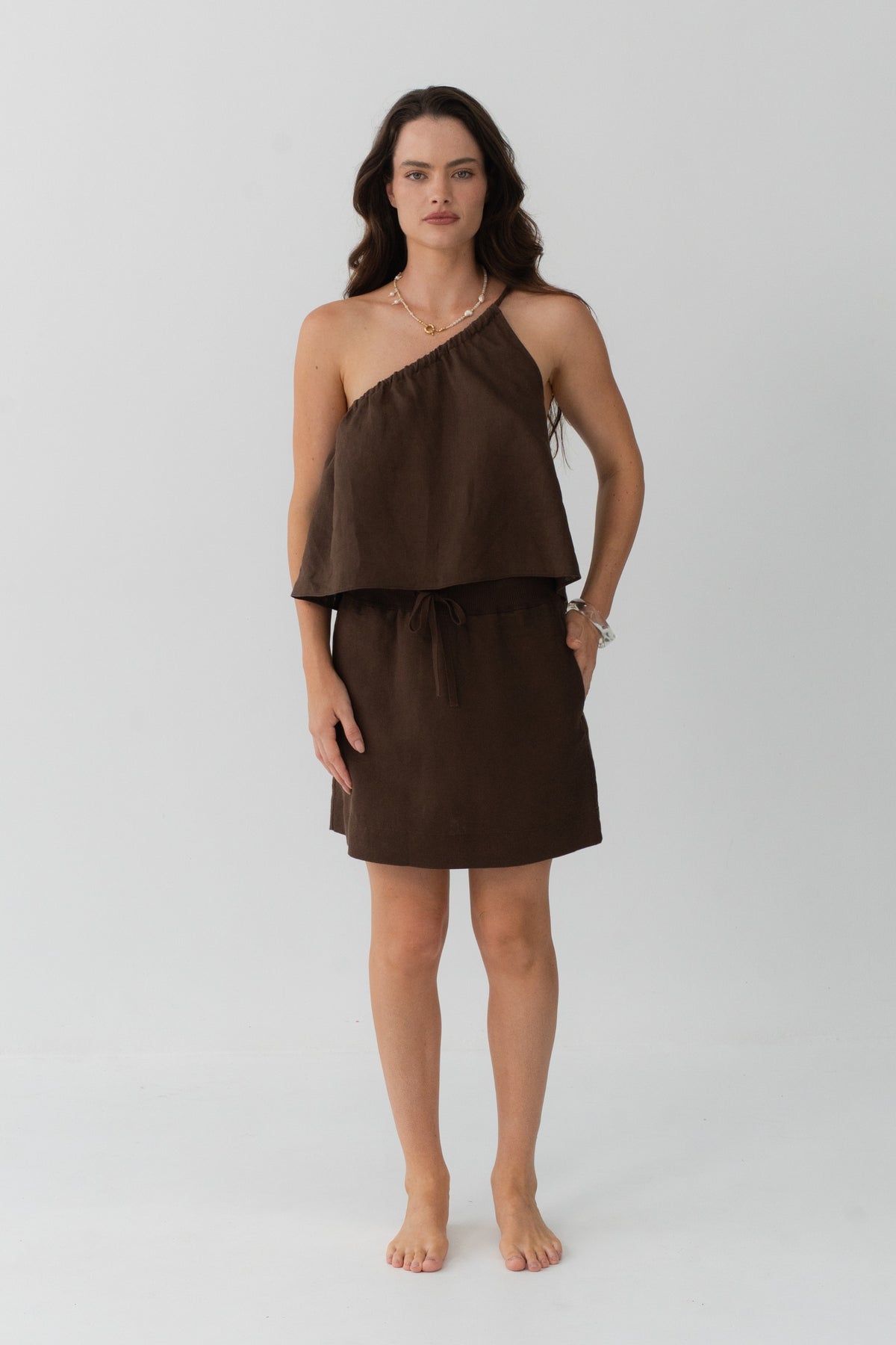 Anelle Linen Mini Skirt in Chocolate - front view, drawstring waistband, worn with Leni Silk Cami in Chocolate - Lilly Pilly Collection