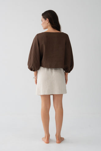 Anelle Linen Mini Skirt in Oatmeal - back view, elasticated waistband, worn with Tilly Cotton Voile Shirt in Chocolate - Lilly Pilly Collection