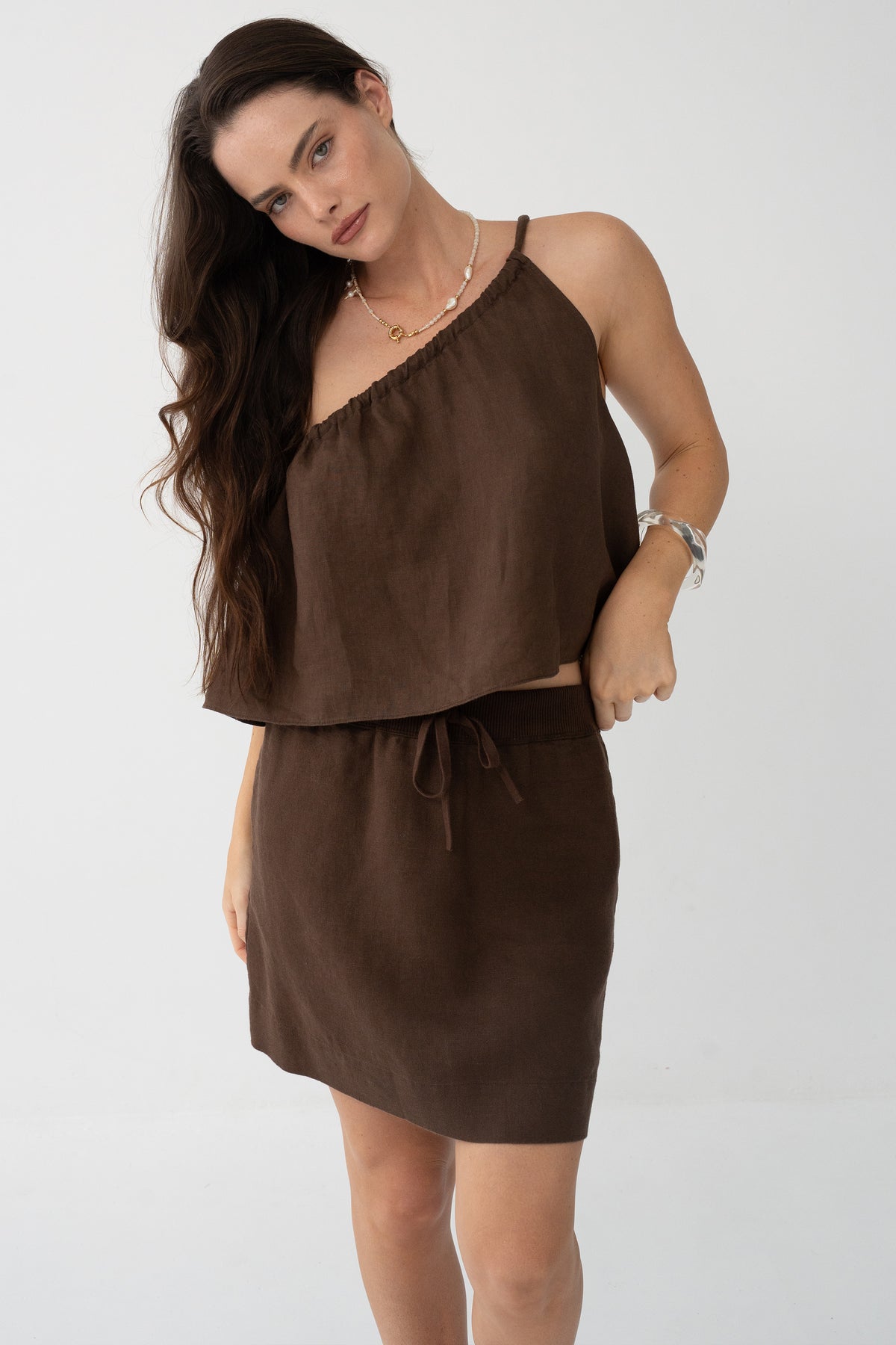 Anelle Linen Mini Skirt in Chocolate - full length, worn with Leni Silk Cami in Chocolate, drawstring waistband, pearl and gold necklace - Lilly Pilly Collection