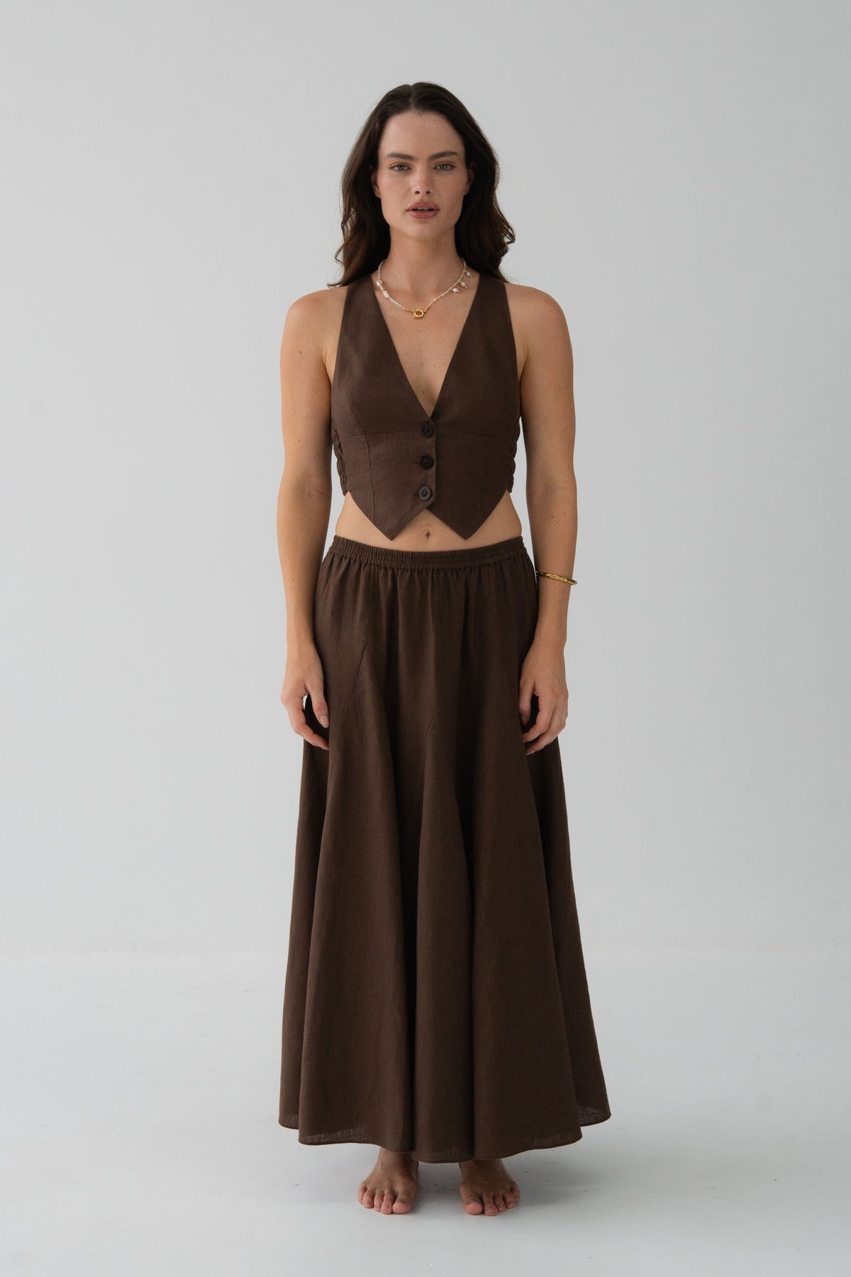 Ari Linen Vest in Chocolate - front view, V-neckline and button-front, styled with matching Riley Linen Skirt - Lilly Pilly Collection