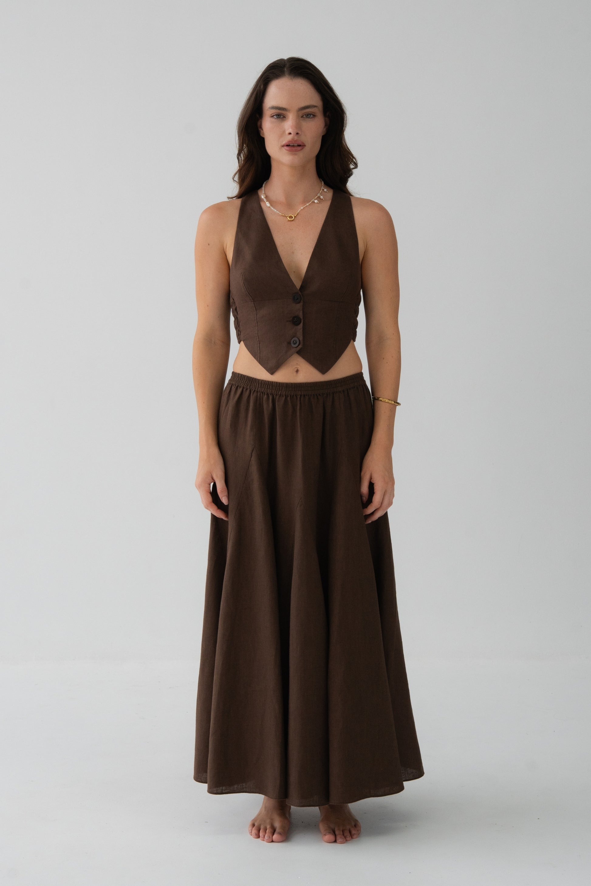 Ari Linen Vest in Chocolate - front view, V-neckline and button-front, styled with matching Riley Linen Skirt - Lilly Pilly Collection