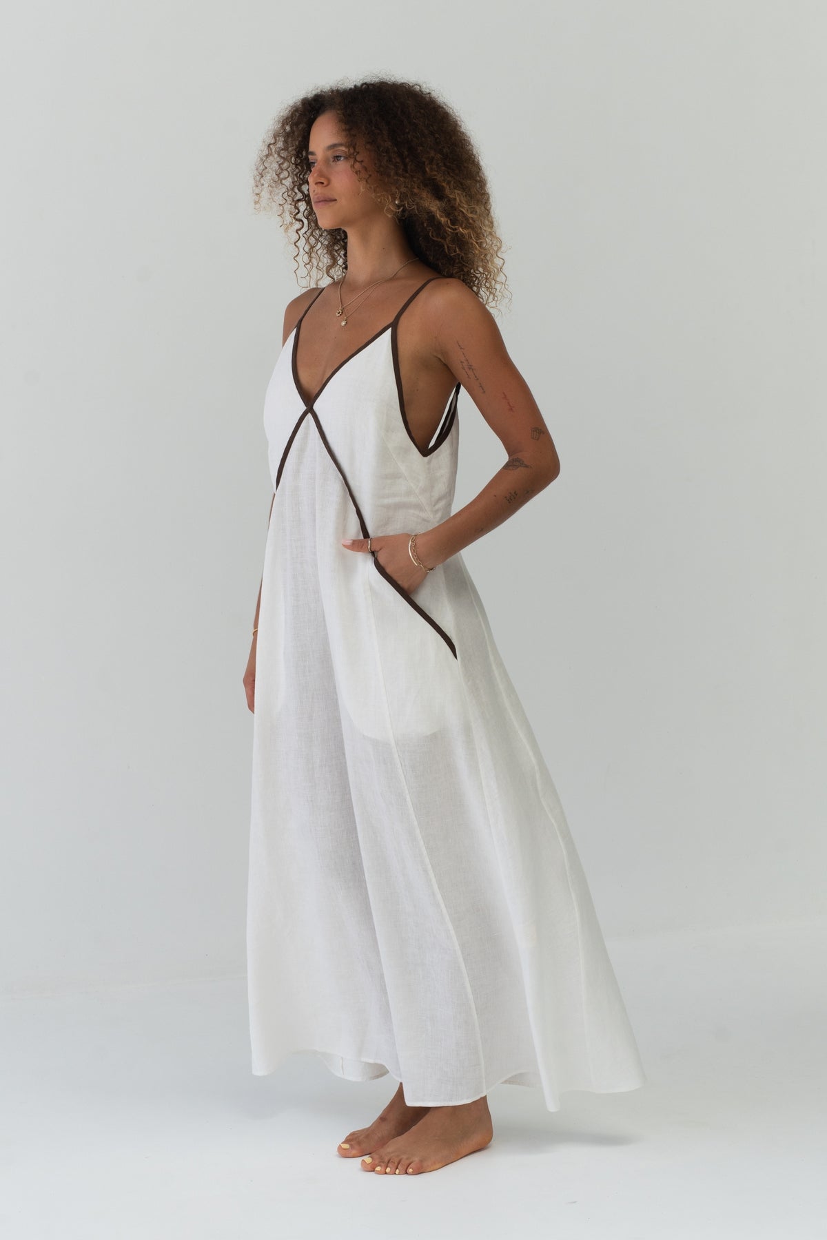 Azalea Linen Maxi Dress in Ivory - side profile, contrast trim detail and relaxed maxi silhouette - Lilly Pilly Collection