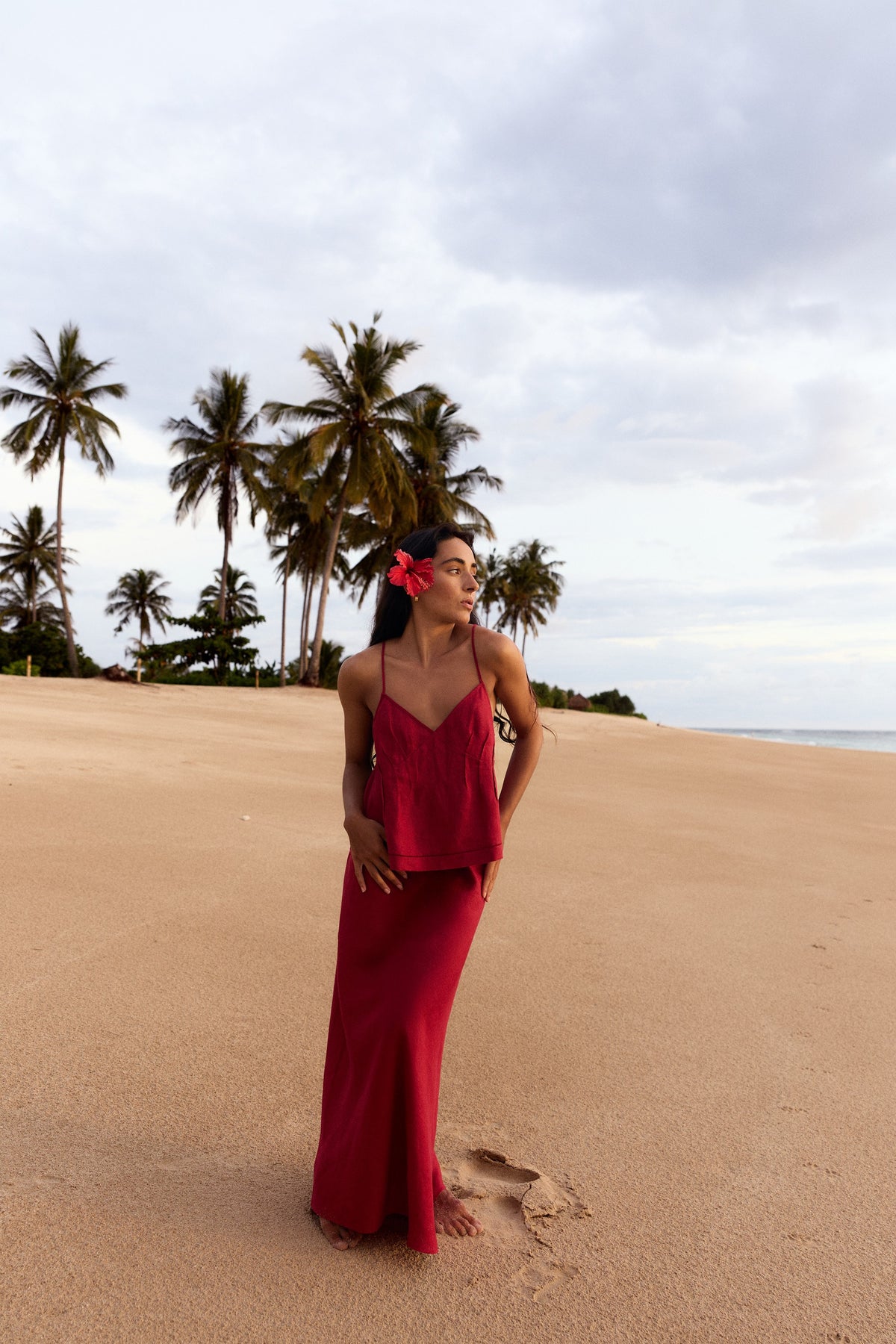 Bea Linen Cami in Cherry Red - full length, styled with matching Riley Linen Maxi Skirt, palm tree beach and ocean backdrop - Lilly Pilly Collection