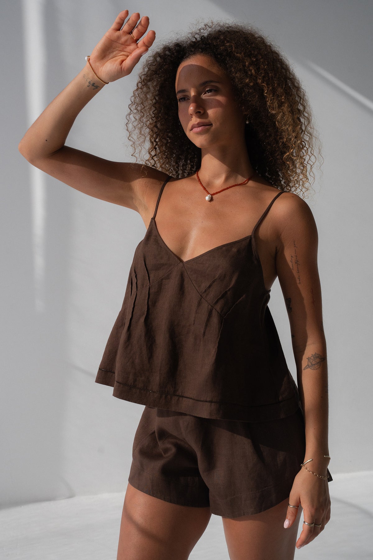 Bea Linen Cami in Chocolate - three-quarter view, V-neckline and spaghetti straps, styled with Gaia Linen Shorts in Chocolate - Lilly Pilly Collection
