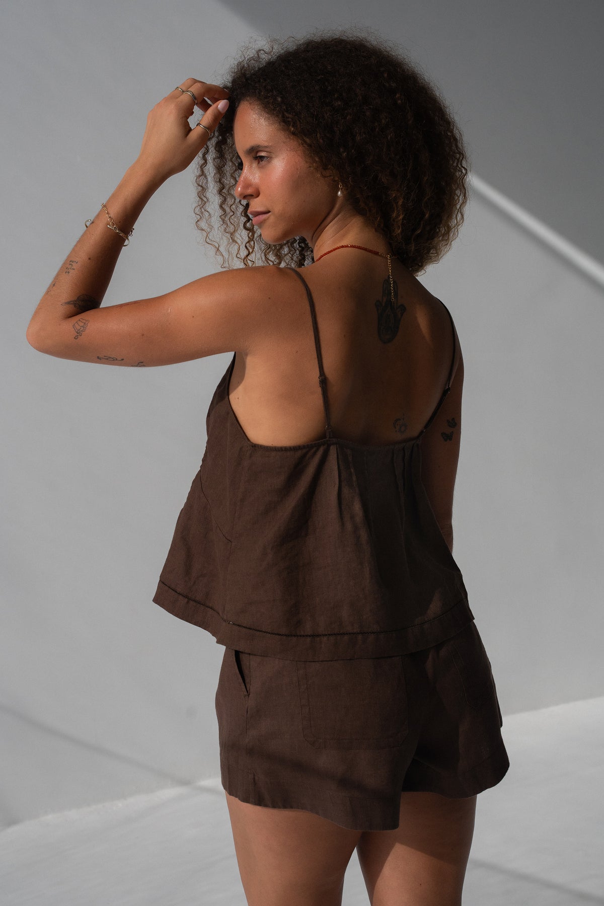 Bea Linen Cami in Chocolate - back view, spaghetti straps and open back, styled with Gaia Linen Shorts in Chocolate - Lilly Pilly Collection