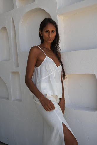 Bea Linen Cami in Ivory - side view, V-neckline and pintuck detail, styled with matching Riley Linen Maxi Skirt, sculptural arch backdrop - Lilly Pilly Collection