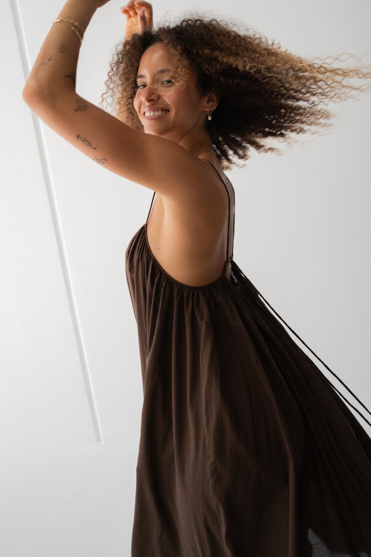 Belle Cotton Midi Dress in Chocolate - three-quarter view, voluminous, flowy midi dress and spaghetti straps - Lilly Pilly Collection
