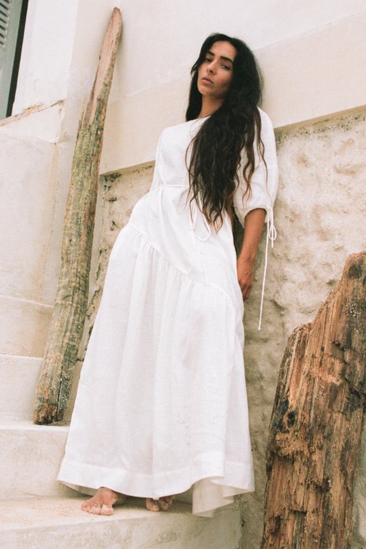 Charlotte Linen Maxi Dress in Ivory - front view standing by a white wall - Lilly Pilly Collection