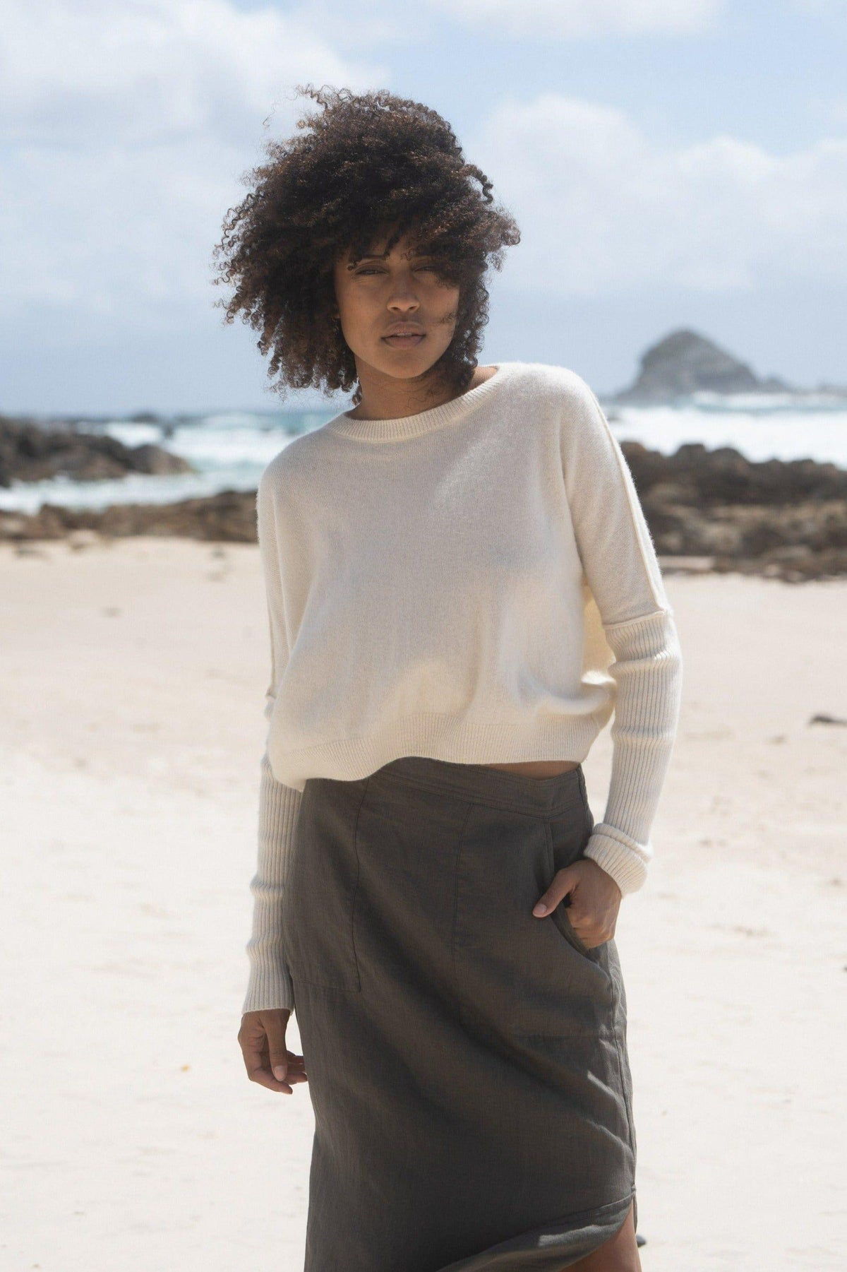 LILLY PILLY Collection Miri Knit made from 95% cashmere and 5% wool in Ivory on  a beach