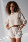 Demi Linen Top in Oatmeal - close-up view, round neckline and puff sleeves with elasticated cuffs, styled with Gaia Linen shorts in Oatmeal - Lilly Pilly Collection