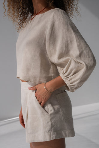 Demi Linen Top in Oatmeal - side view, puff sleeves with elasticated cuffs, styled with Gaia Linen shorts in Oatmeal - Lilly Pilly Collection