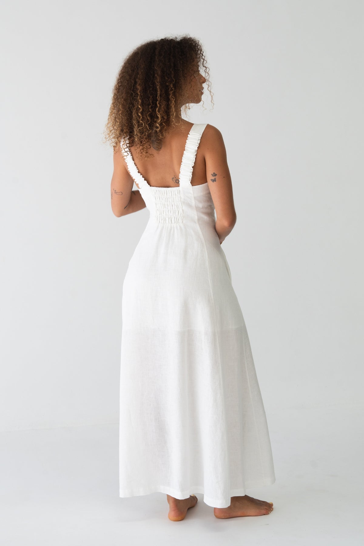 Eden Linen Midi Dress in Ivory - back view, open back with smocked panel and wide ruffled straps - Lilly Pilly Collection