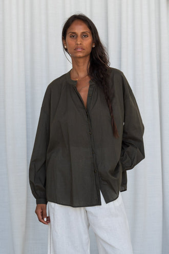 Ember Cotton Voile Shirt in Khaki - front view, collarless button-front, worn with Oli Linen Pants in Ivory, studio setting - Lilly Pilly Collection