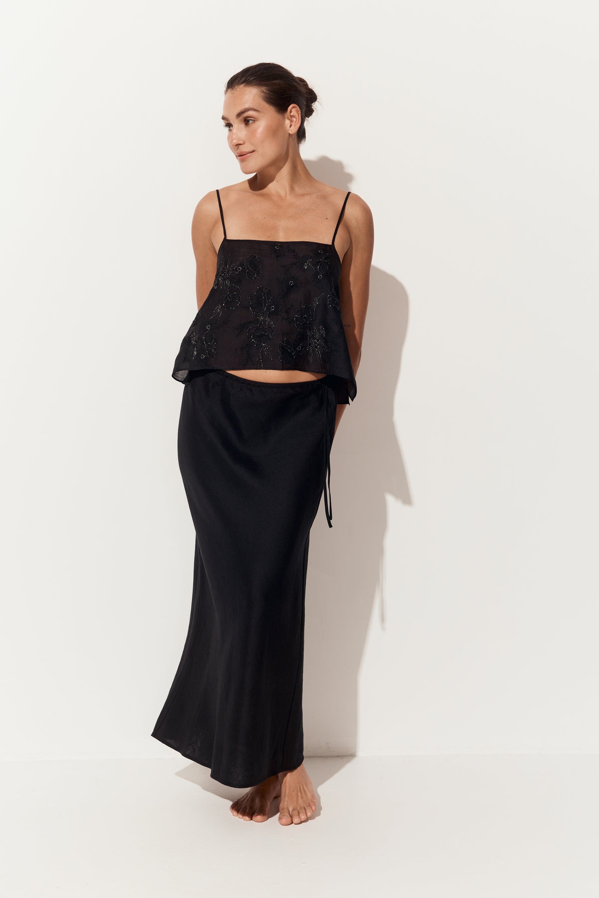 Flora Ramie Cami in Black - full length three-quarter view, styled with Riley Bias Linen Midi Skirt in Black, white studio - Lilly Pilly Collection