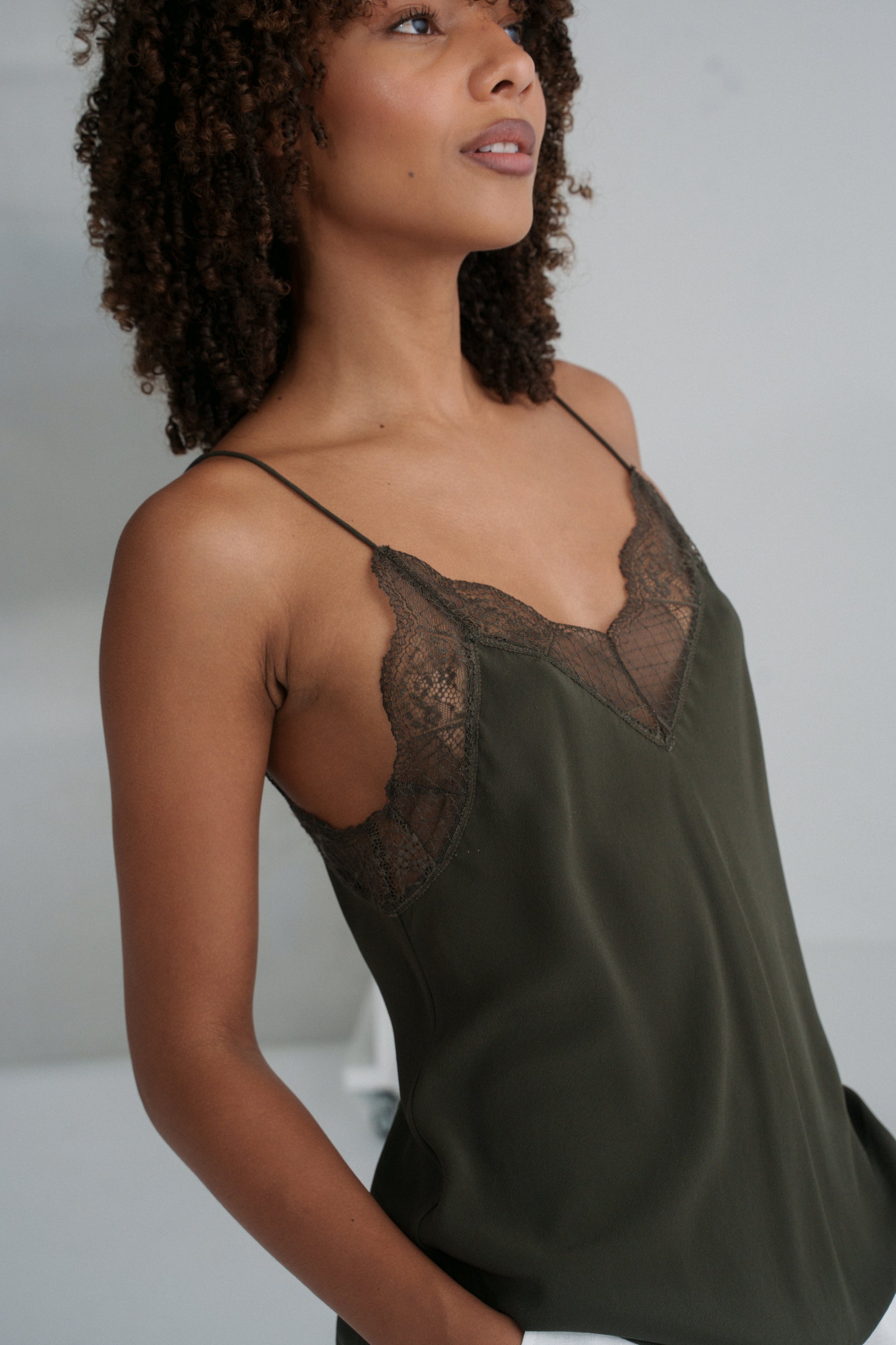 LILLY PILLY woman wearing Frankie silk cami in khaki in studio