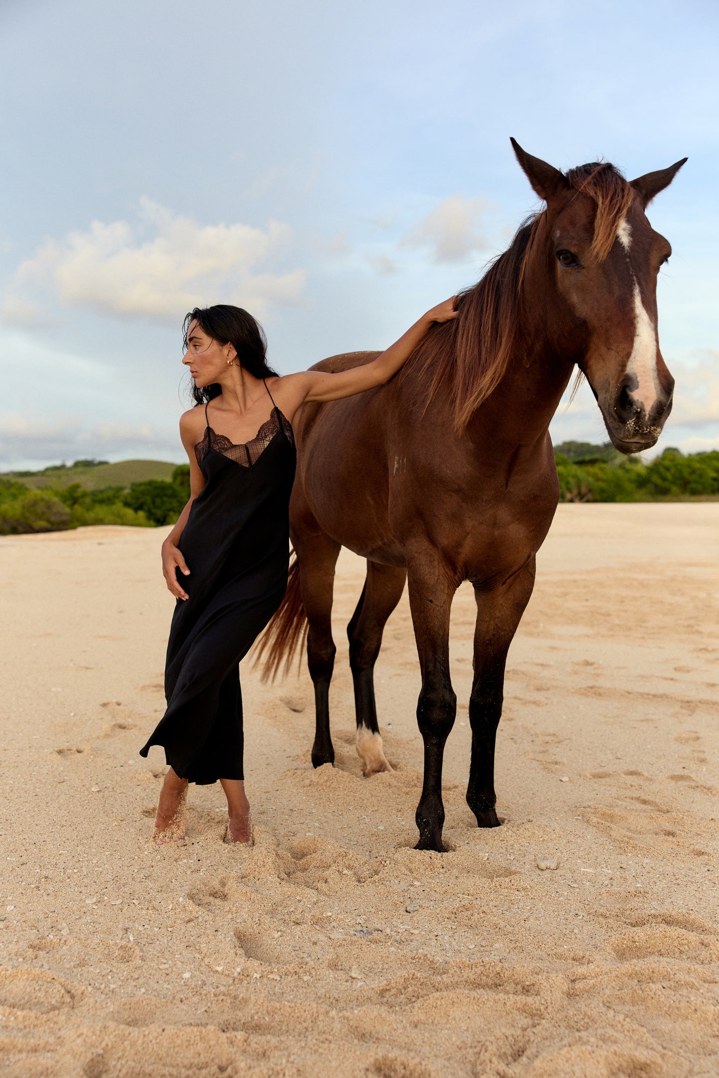 Freya Black Silk Slip Dress - editorial outdoor shot, fluid silk silhouette - Lilly Pilly Collection