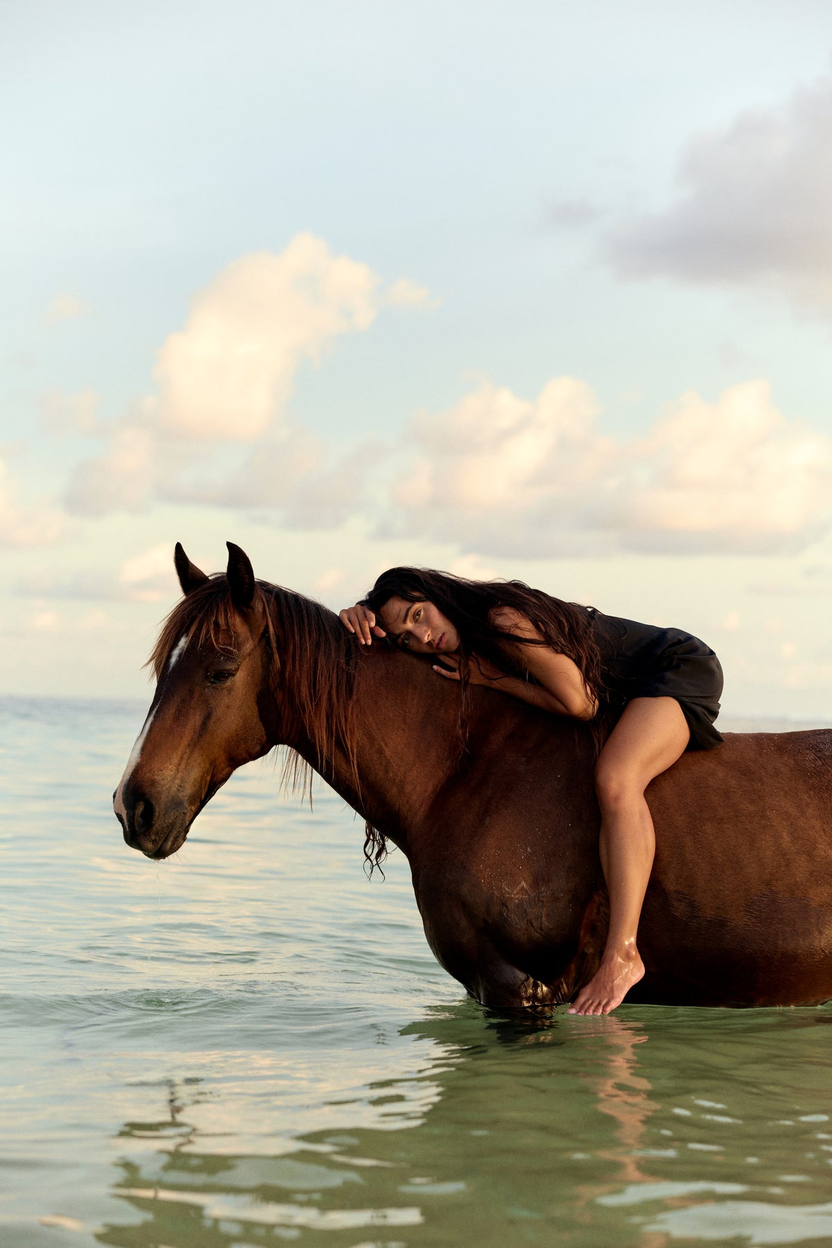 Freya Black Silk Slip Dress - woman seated on a horse, lace V-neckline, outdoor setting - Lilly Pilly Collection