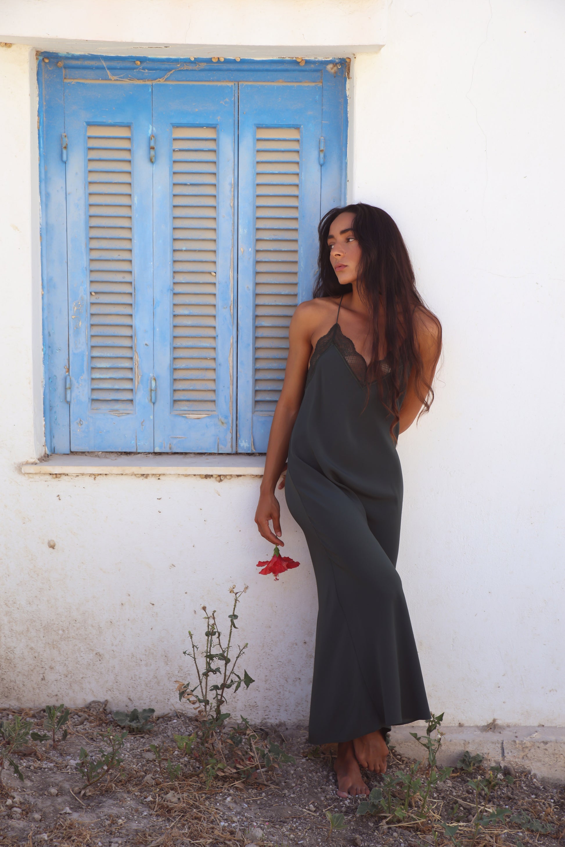 Freya Silk Midi Slip Dress in Forest Green - full-length side view showing fluid midi length and spaghetti straps - Lilly Pilly Collection