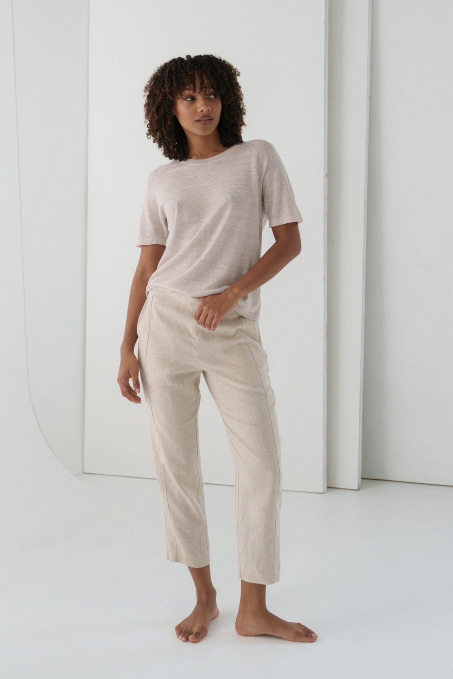 Woman wearing Grace linen knit top and Emer oatmeal linen pants