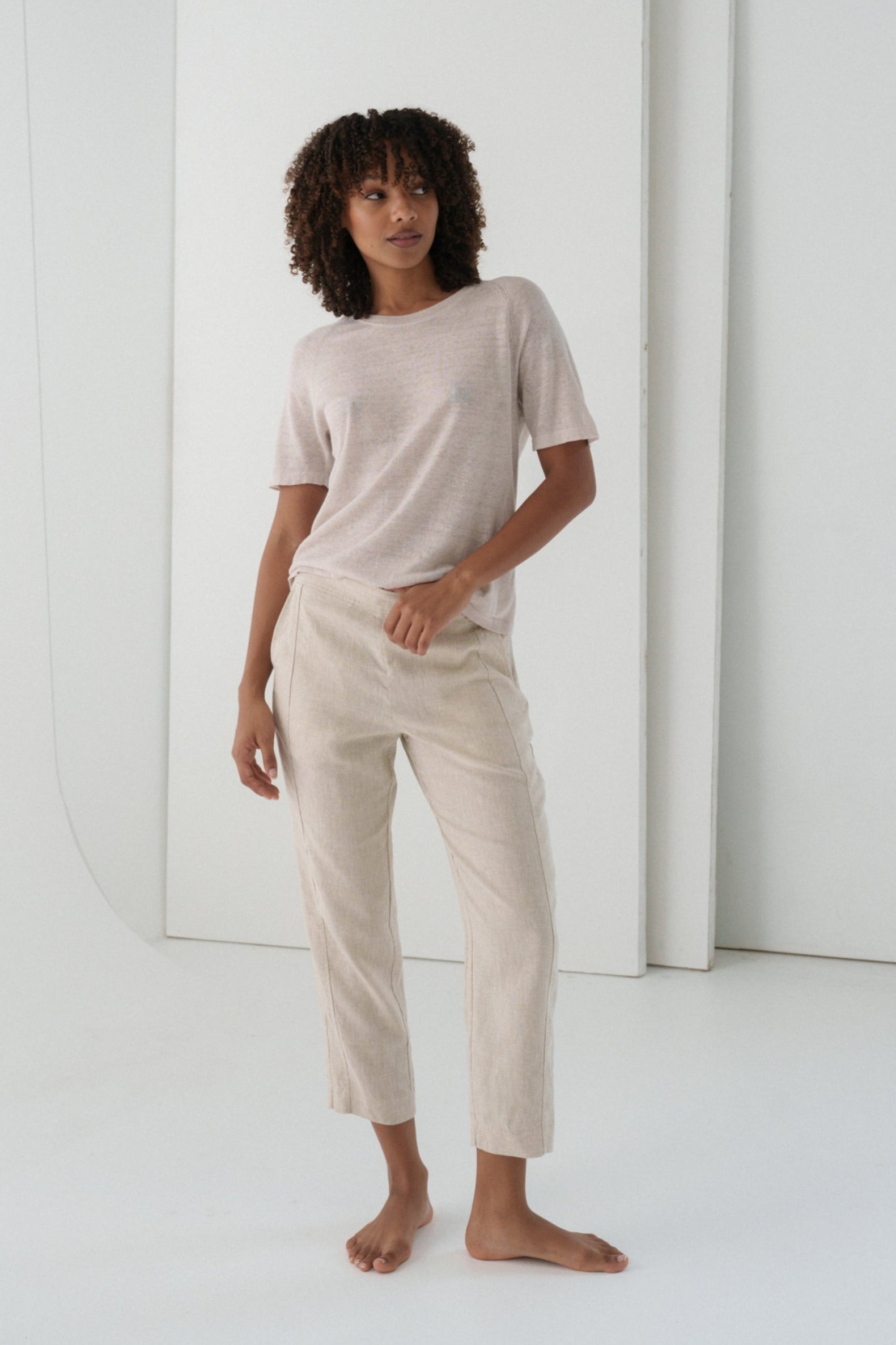 Woman wearing Grace linen knit top and Emer oatmeal linen pants