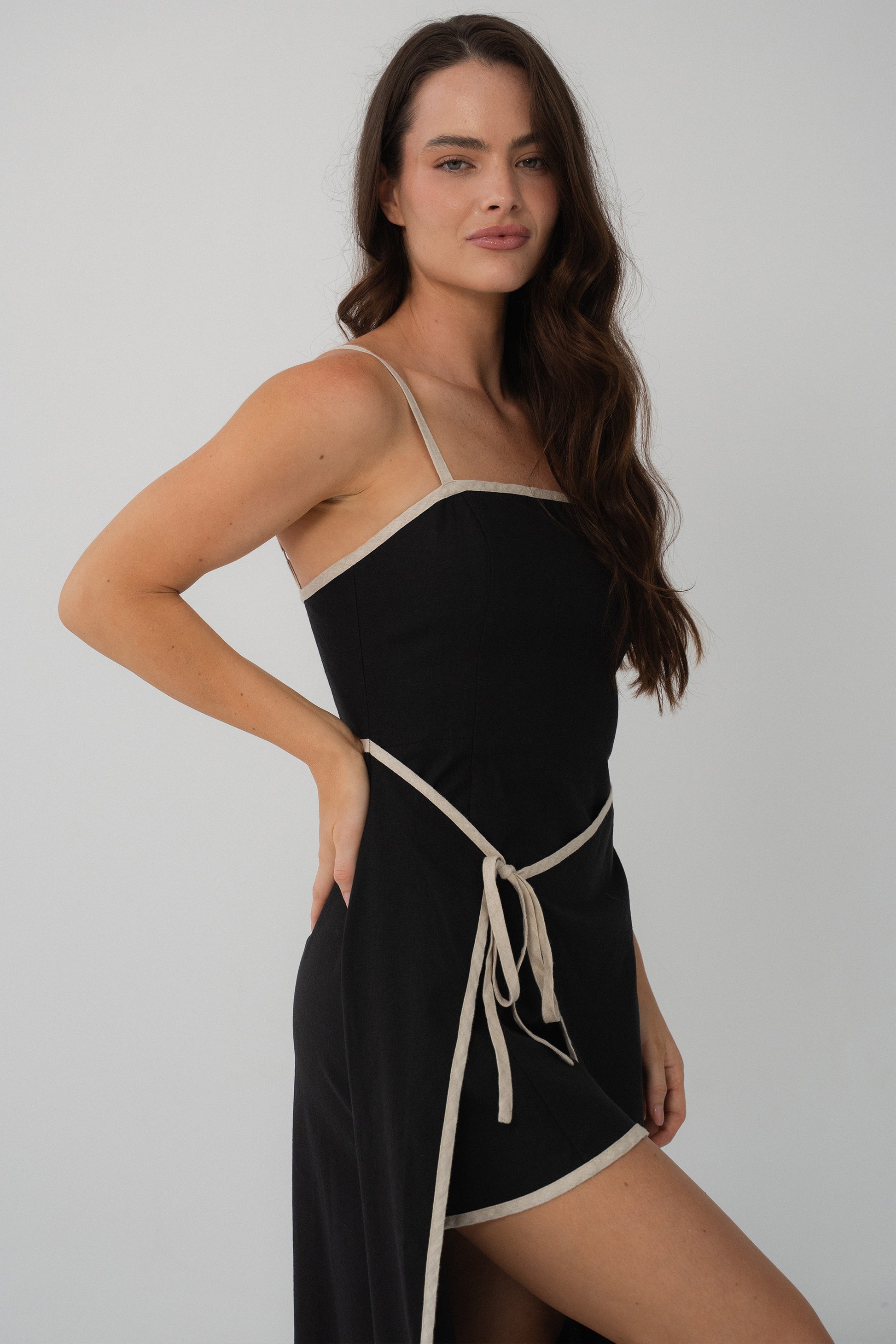 Side view of Hailey Linen sleeveless midi dress in Black with oatmeal binding - Lilly Pilly Collection