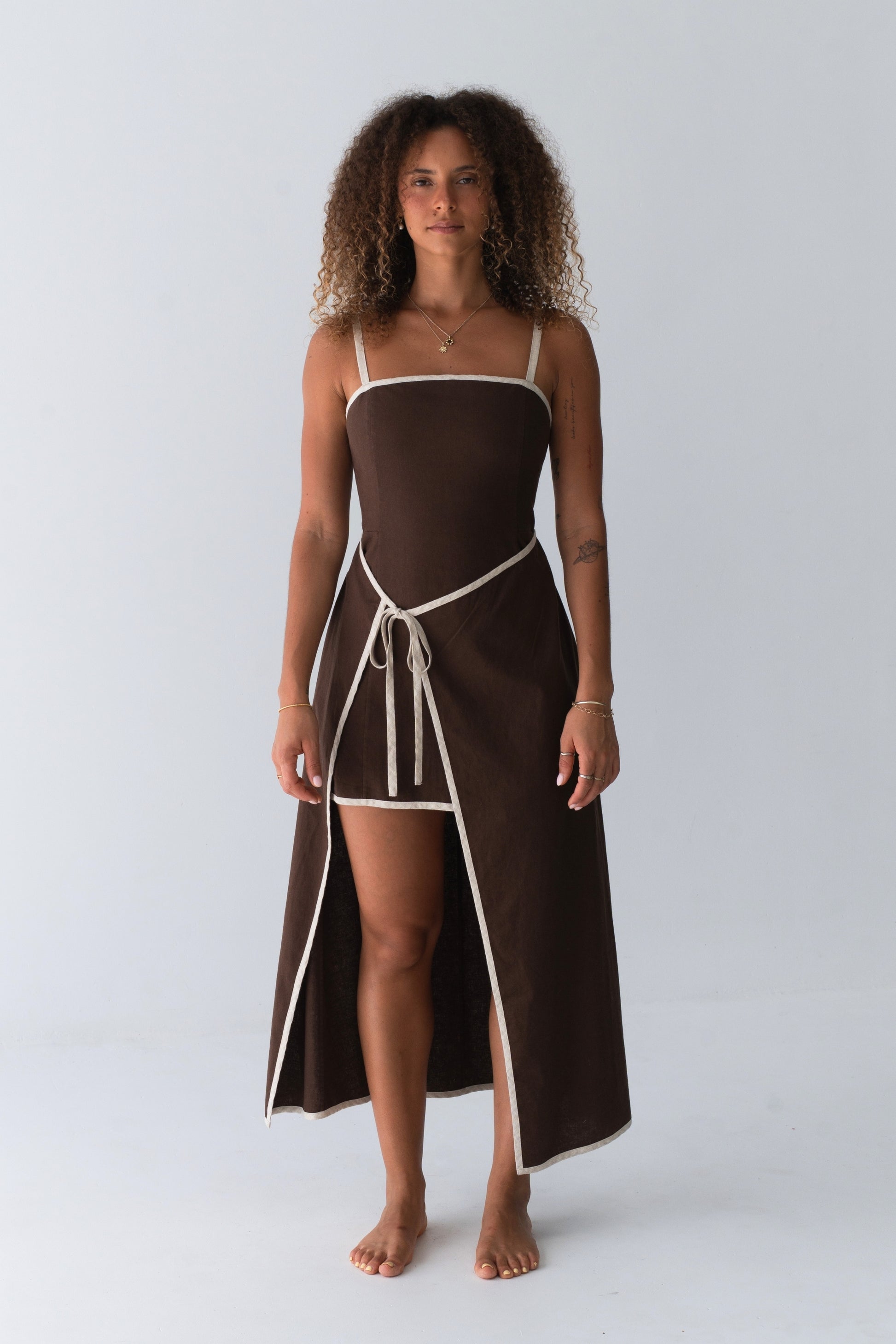 Woman in Hailey Linen midi dress in Chocolate standing in studio setting - Lilly Pilly Collection