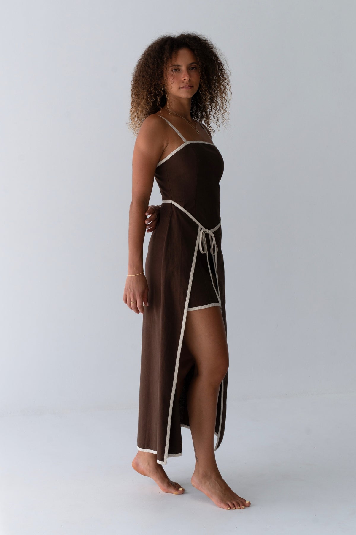 Side view of Hailey Linen midi dress in Chocolate standing in studio setting - Lilly Pilly Collection