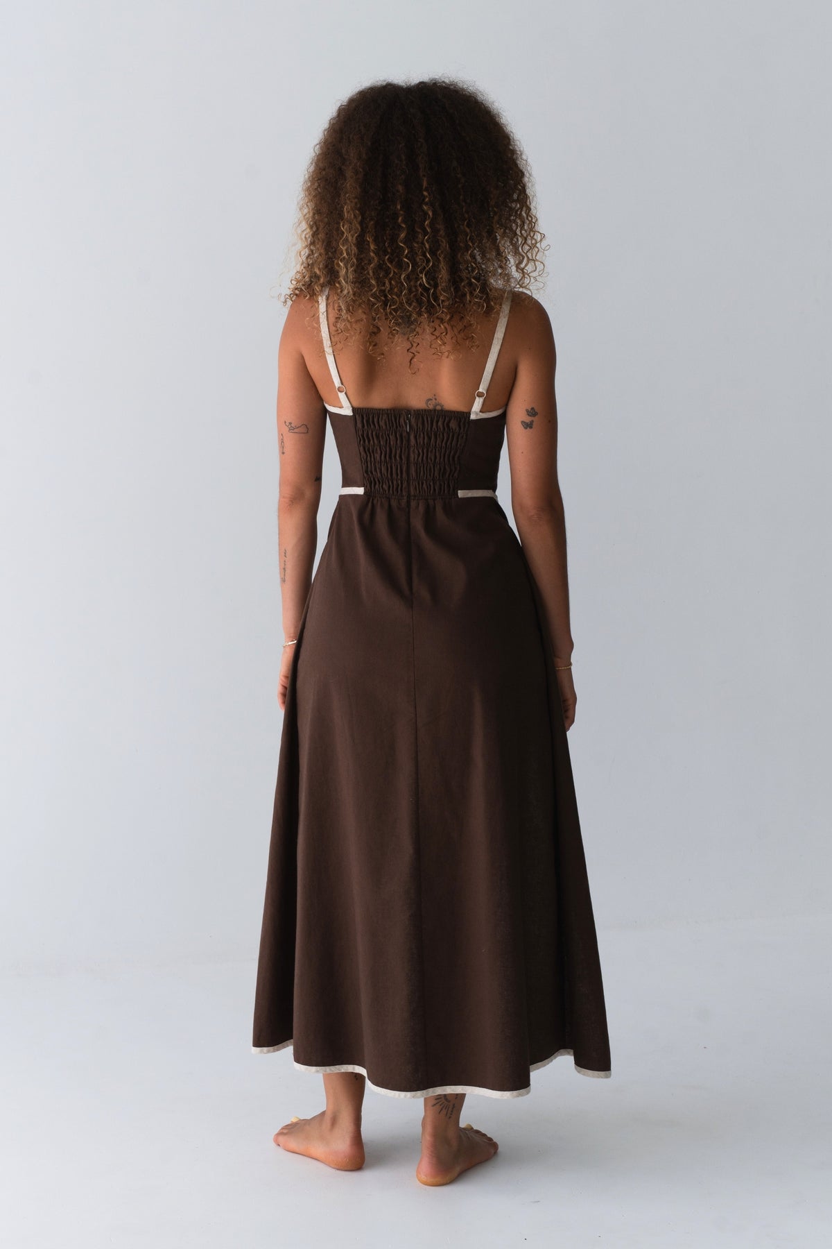Back view of Hailey Linen midi dress in Chocolate standing in studio setting - Lilly Pilly Collection