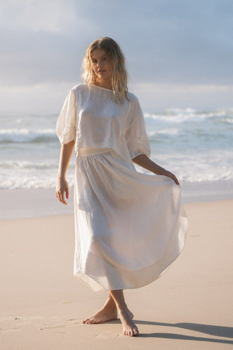 Hannah Linen Maxi Skirt in Ivory - full length, walking on beach, elasticated waist, worn with oversized top - Lilly Pilly Collection